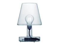 Transparante tafellamp met zichtbare gloeilamp en zwarte fitting, op een witte a